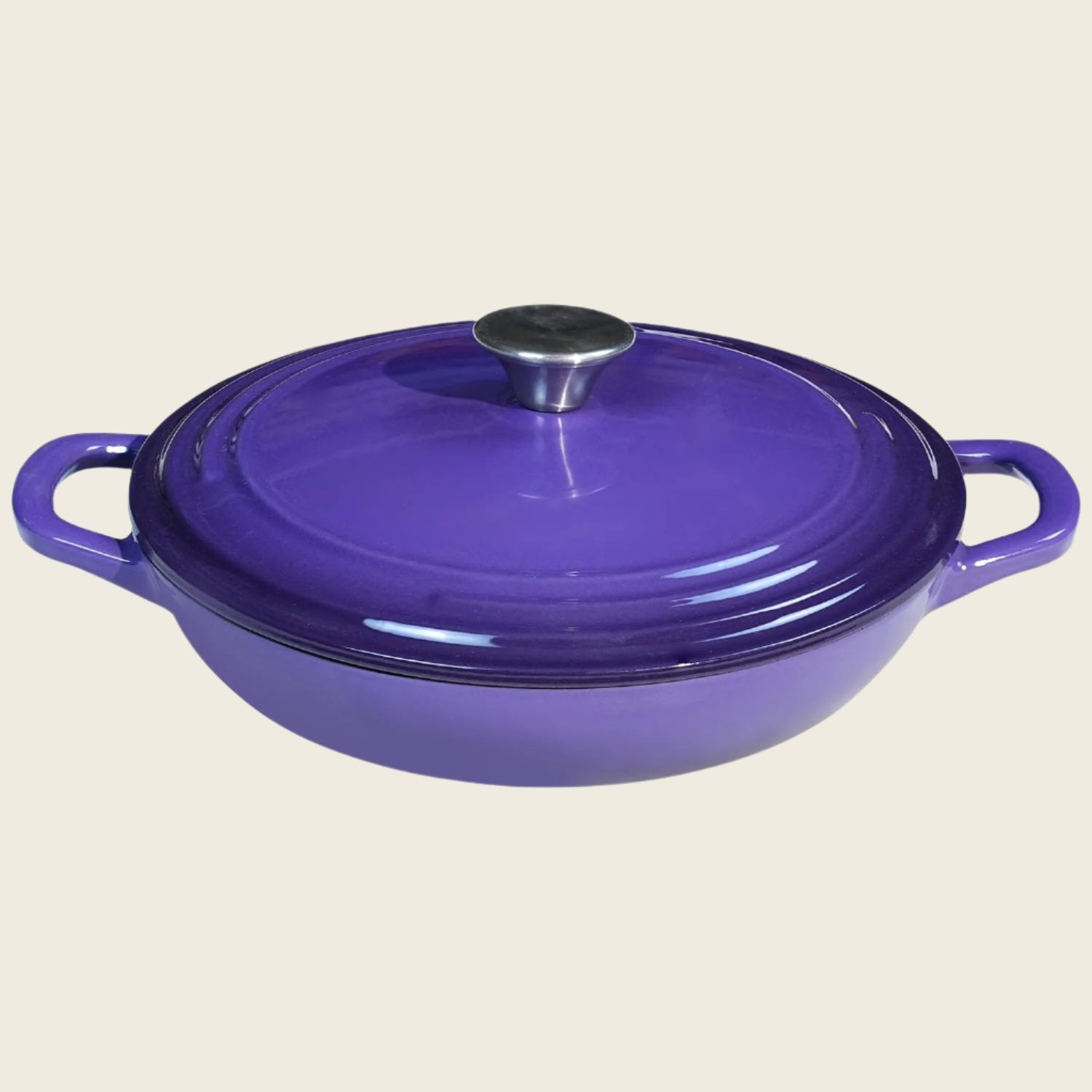 A purple enameled cast iron braiser with a lid, featuring a round shape and two handles.