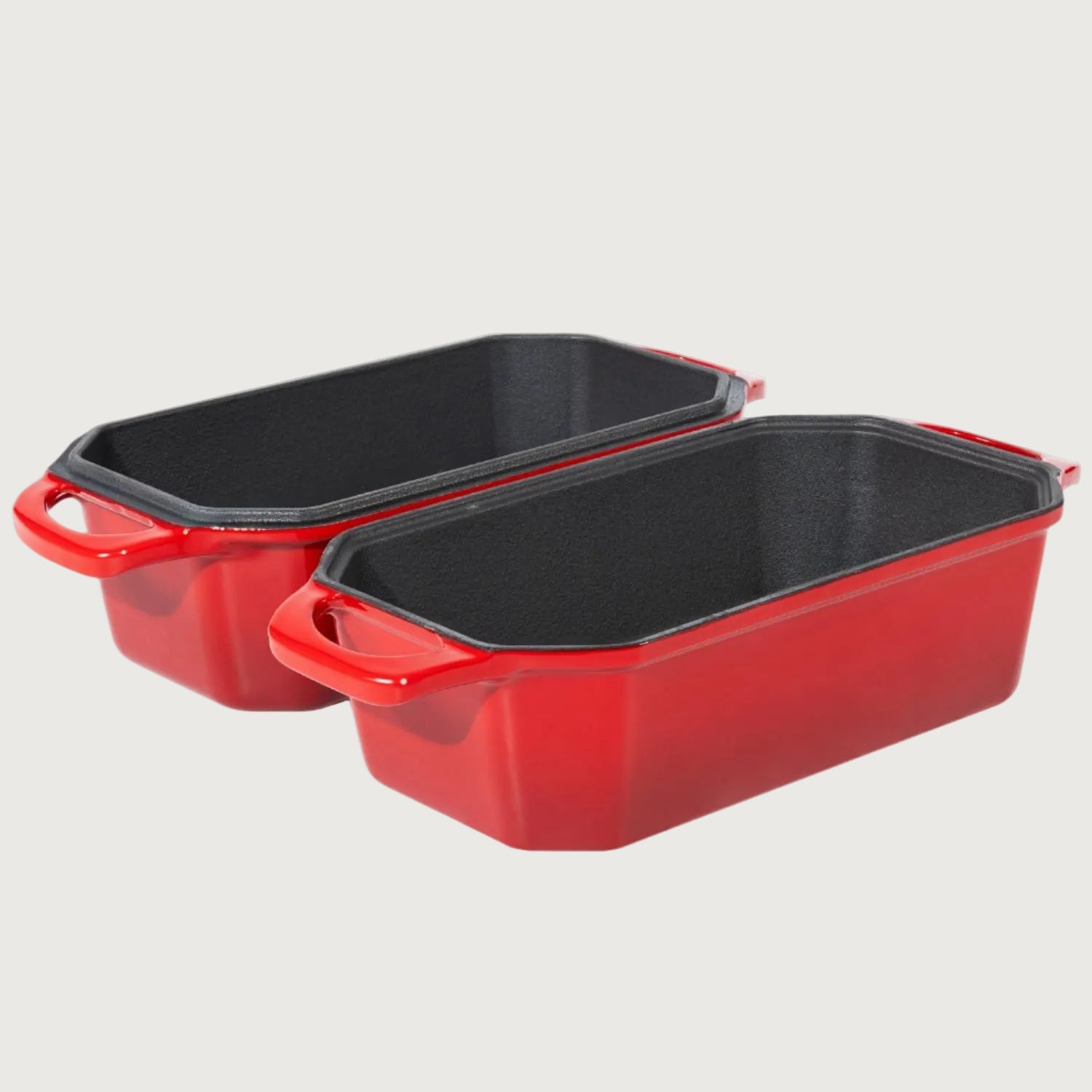 Two red loaf pans with black interior on a beige background new zealand