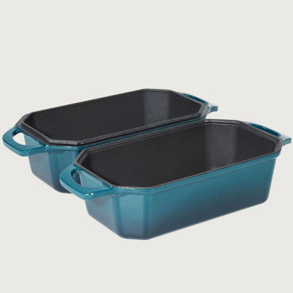 Two blue baking pans with black interior on a beige background