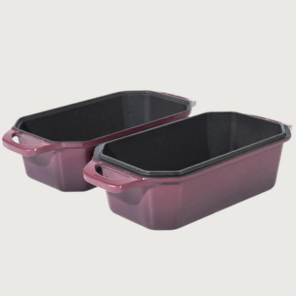 Two purple baking dishes with black interior on a beige background