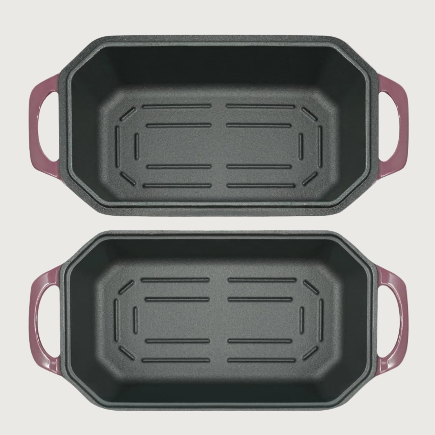 Two black rectangular baking pans with purple handles on a beige background