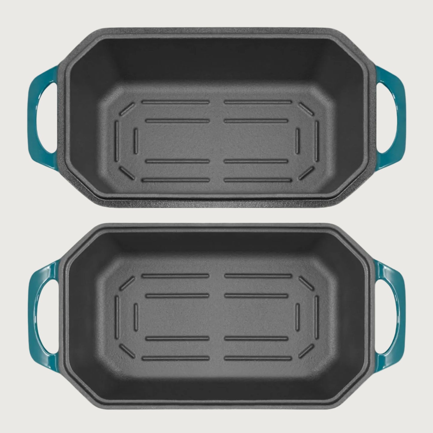 Two black roasting pans with blue handles on a beige background