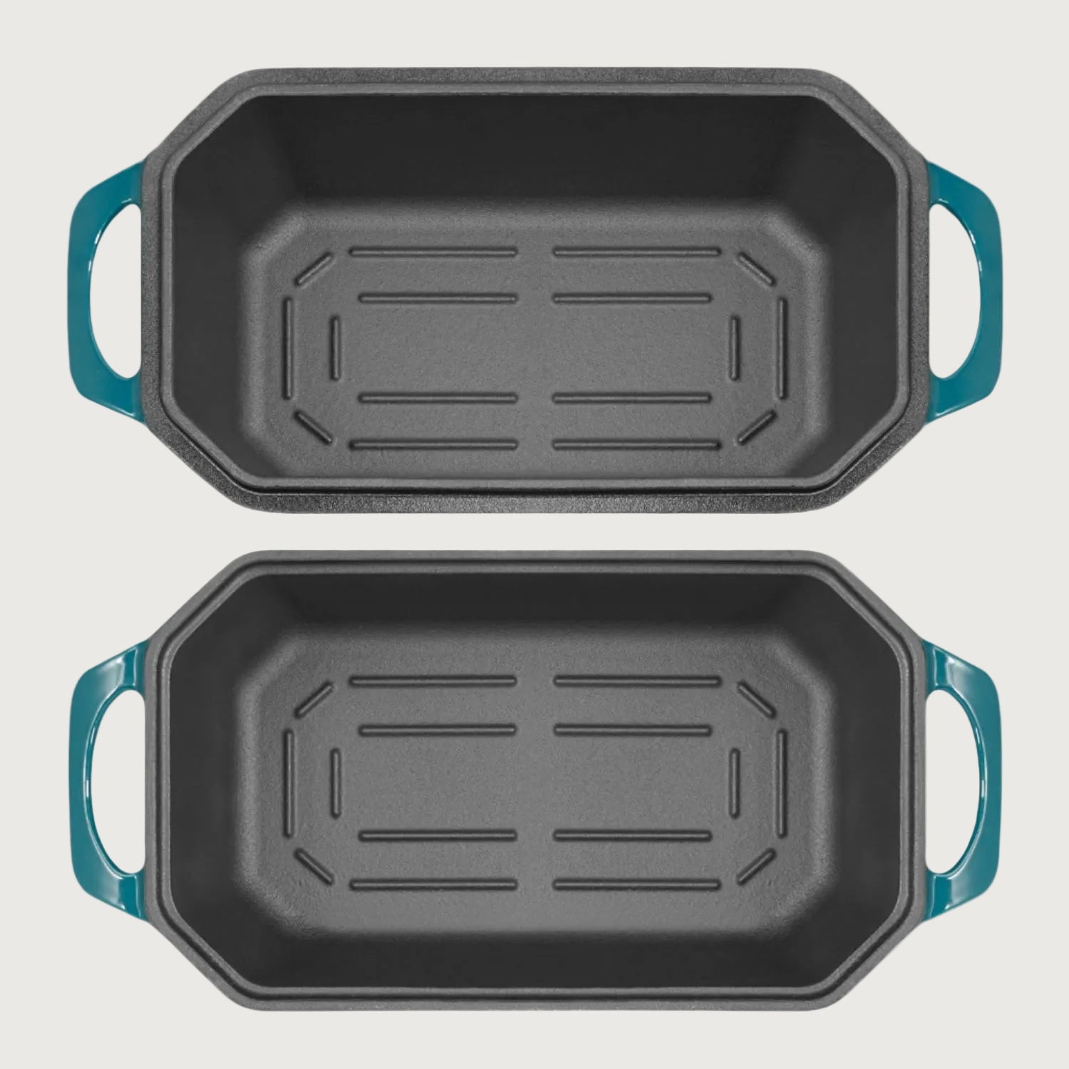 Two black roasting pans with blue handles on a beige background