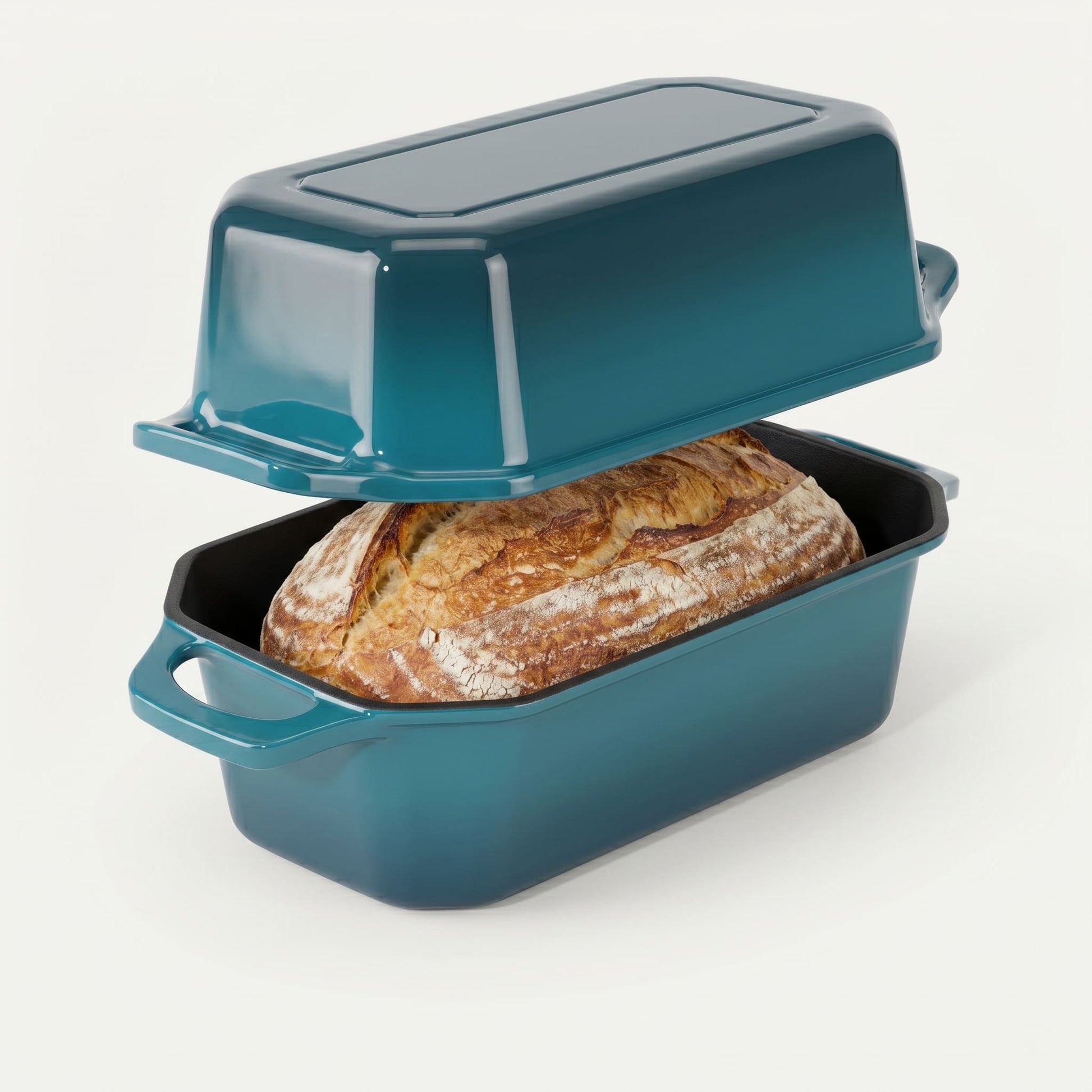 Teal bread loaf pan with a loaf of bread inside on a white background