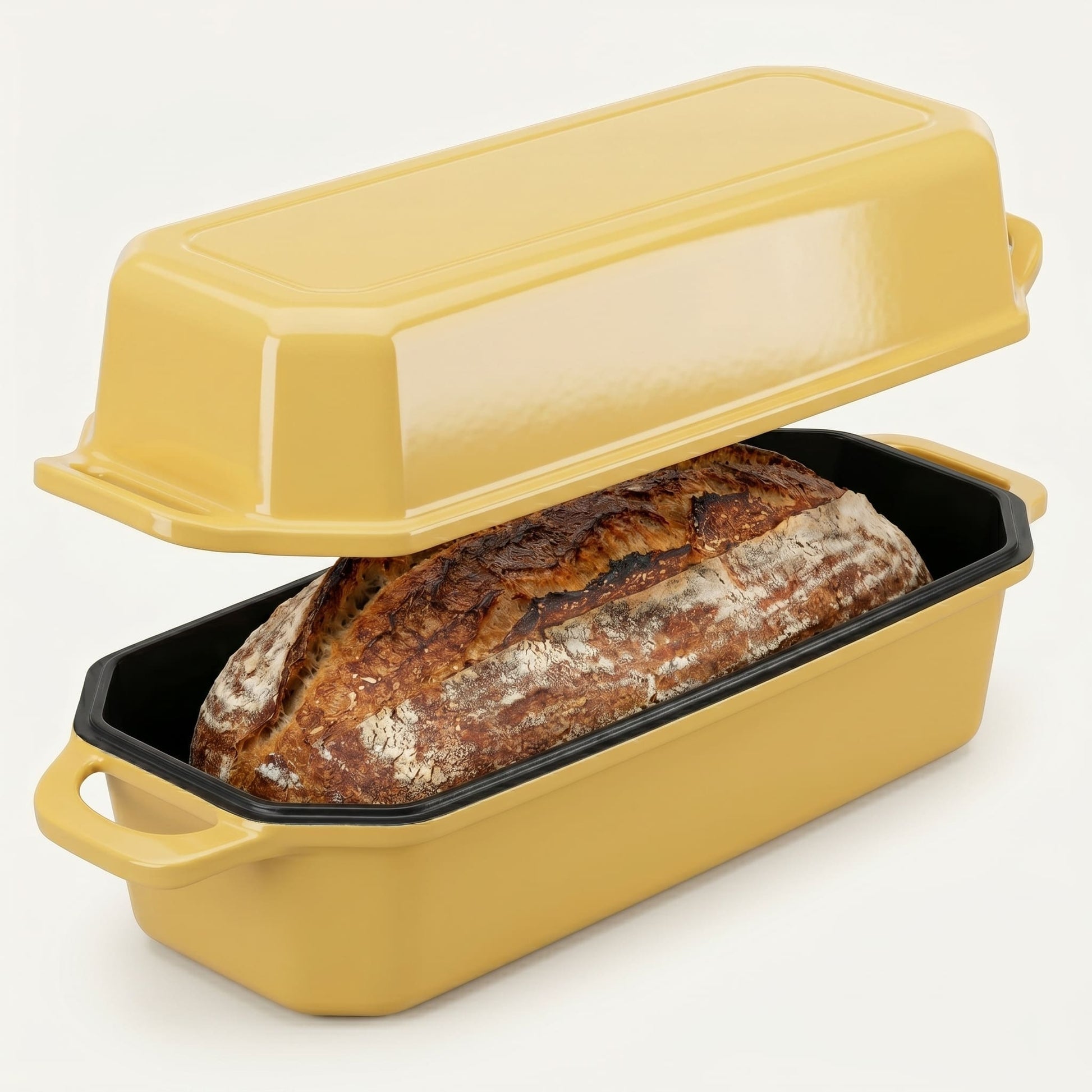 Yellow bread loaf pan with a loaf of bread inside on a white background