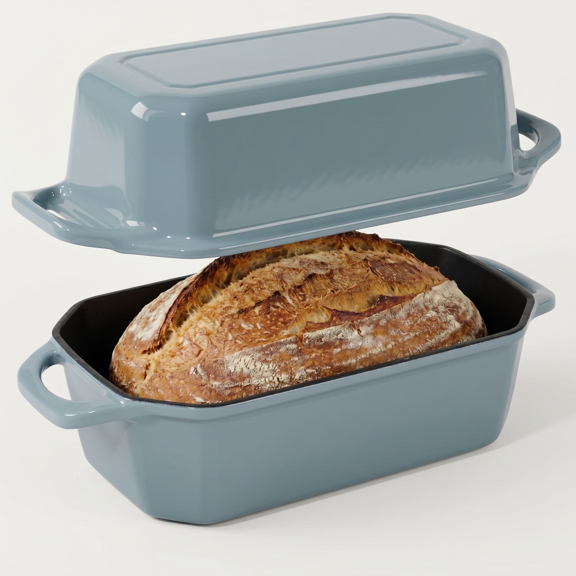 Blue enameled bread loaf pan with a loaf of bread inside
