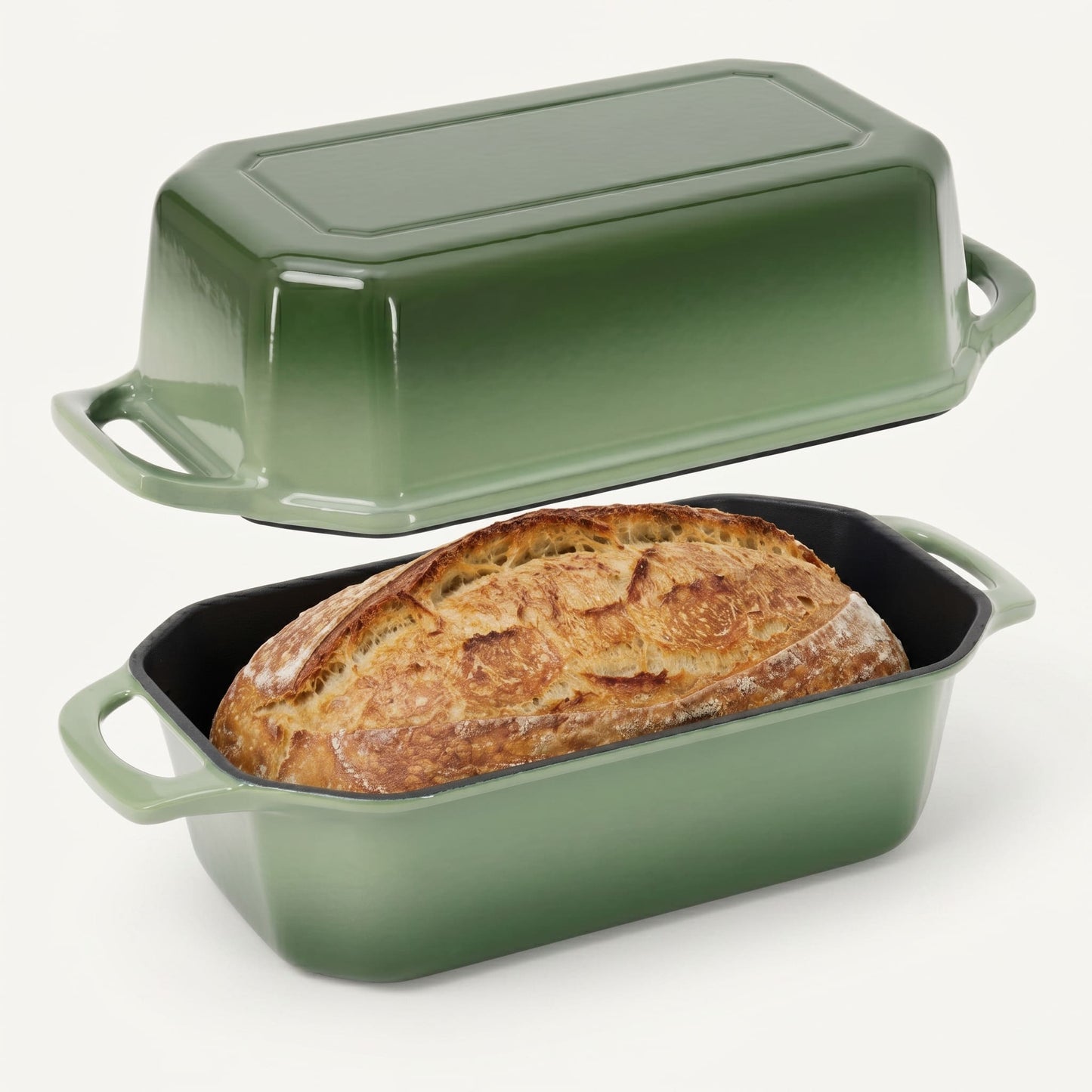Green bread loaf pan with a loaf of bread inside on a white background