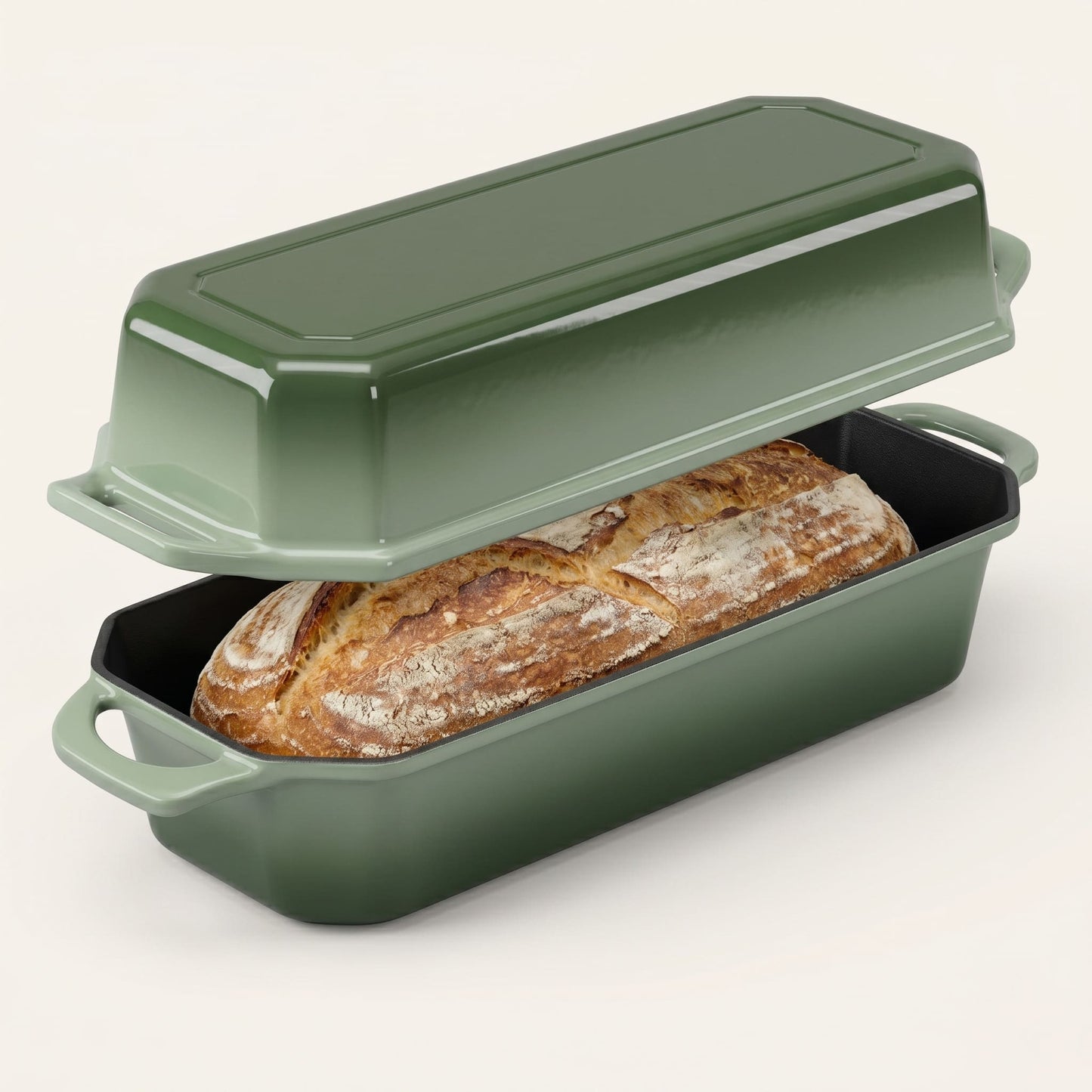 Green bread loaf pan with a loaf of bread inside on a white background