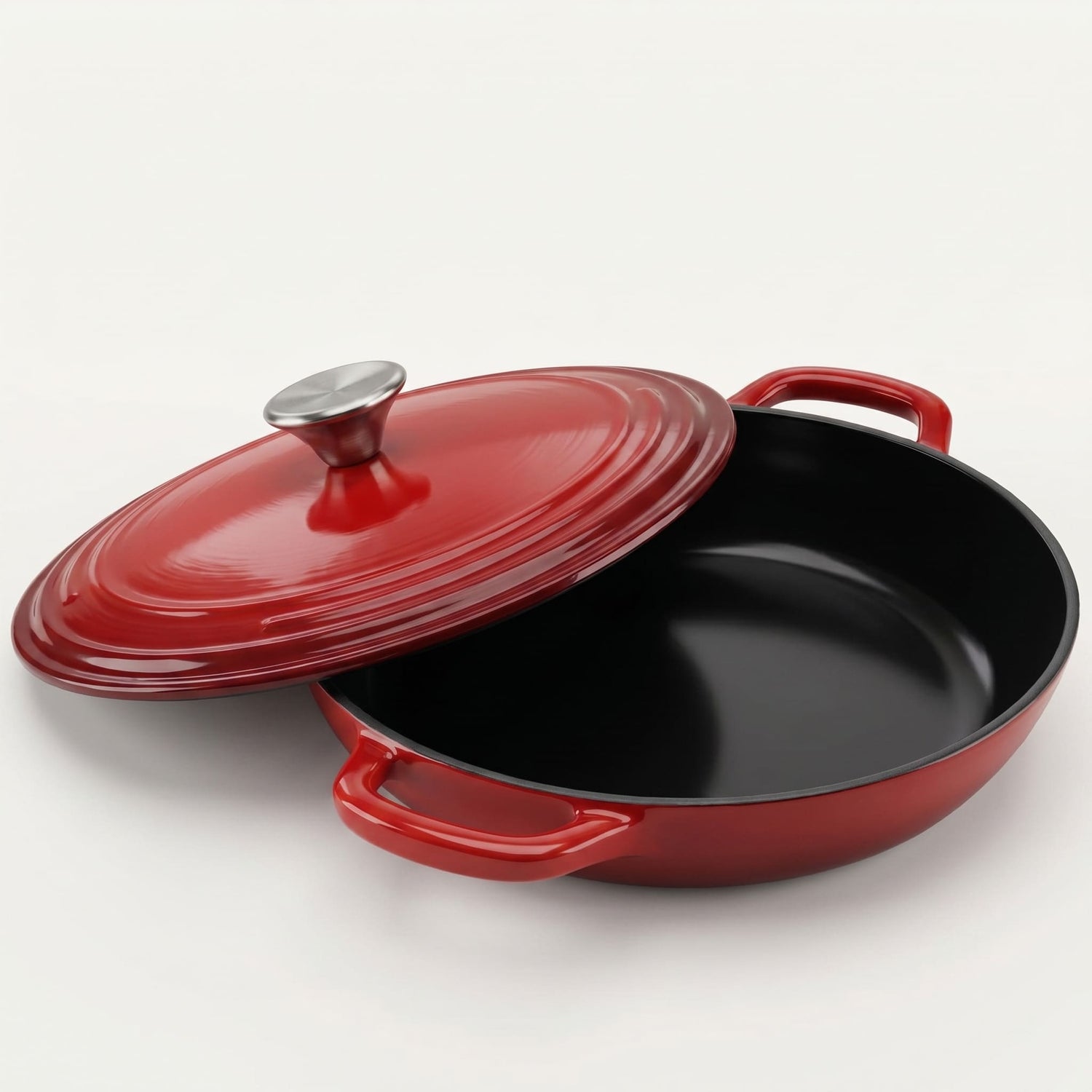 Red cast iron skillet with lid on a white background