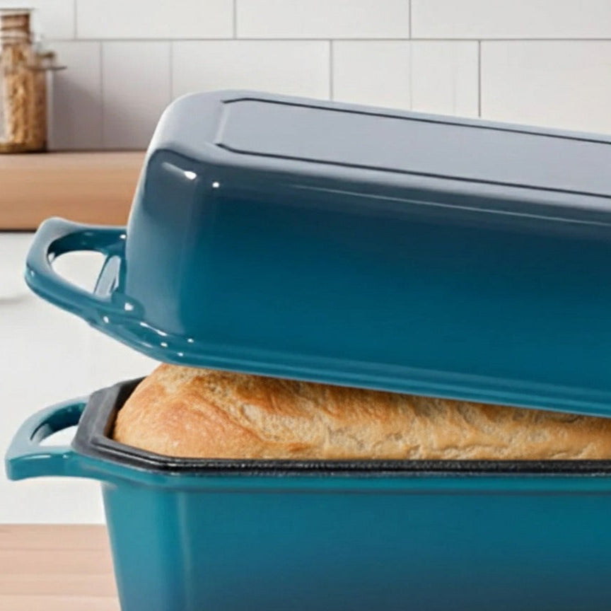 Blue bread bin with a loaf of bread inside, set against a kitchen background.