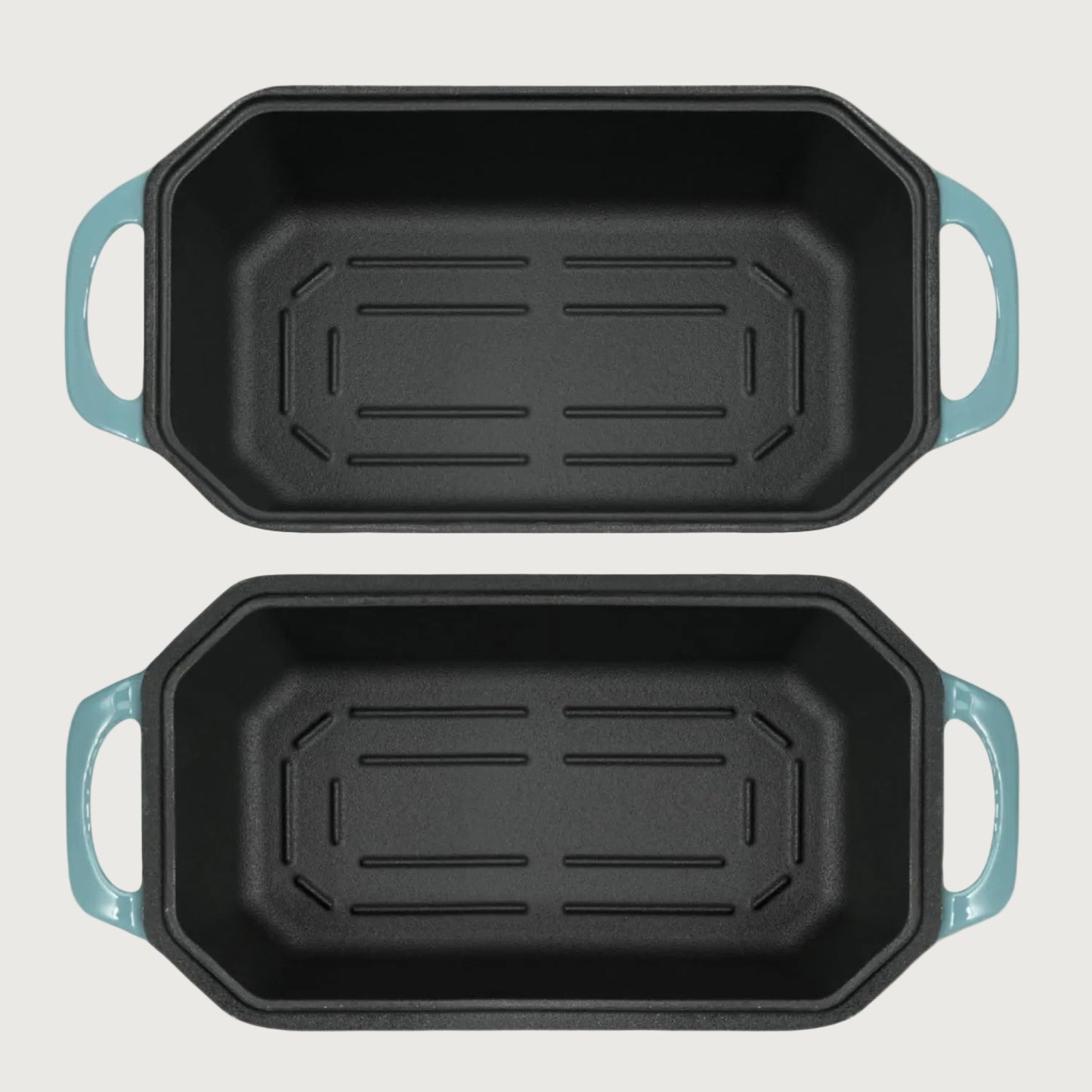Two rectangular baking loaf pans with blue handles on a white background