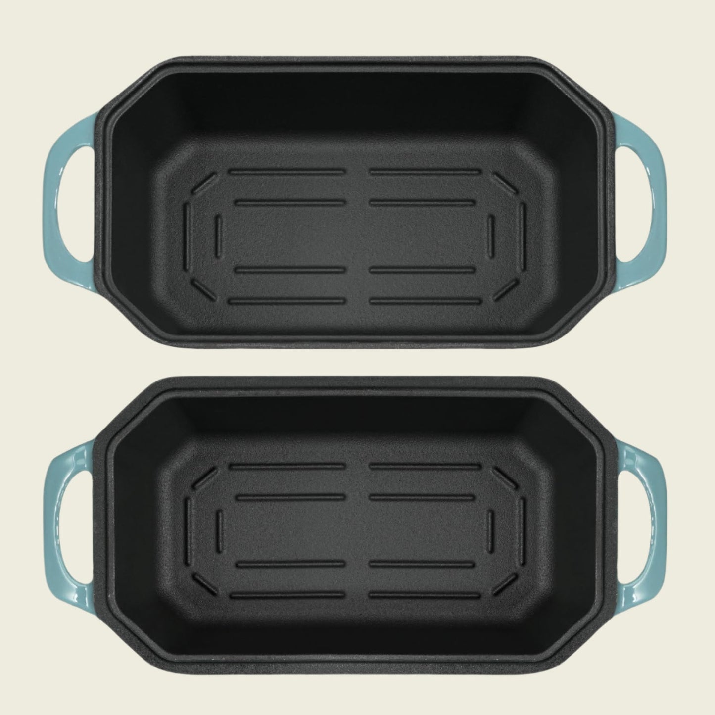 Two black rectangular baking pans with blue handles on a white background