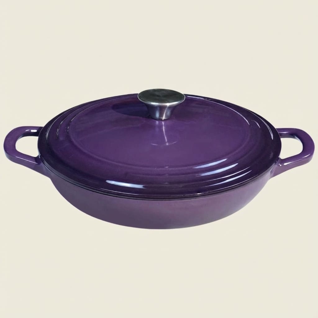Purple cast iron cookware with a lid on a beige background
