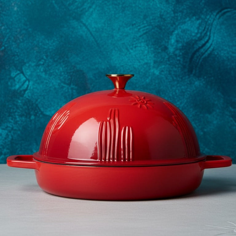 Red ceramic dish with lid on a gray surface against a blue textured background